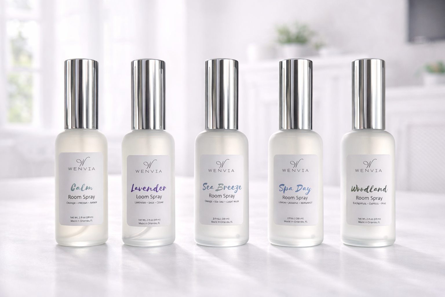 Luxurious room spray bottles with frosted glass and a sleek silver cap