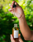 rose glow facial serum made by Wenvia shown in a dropper bottle.